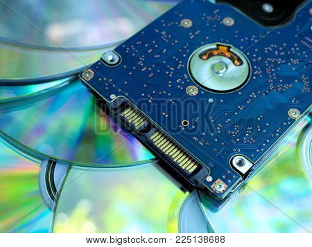 SATA Harddisk drive on compact discs background