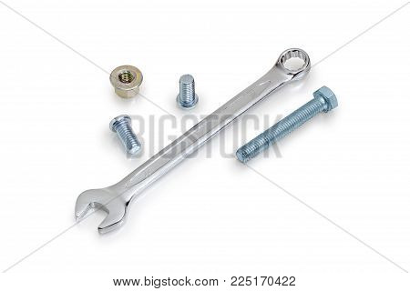 Chrome-plated combination wrench open at one end and ring at the other among of bolts, screws, nuts on a white background
