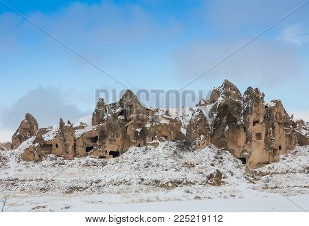 View Of Ancient Uchisar Cave Town And A Castle Of Uchisar Dug From A Mountains In Cappadocia, Centra