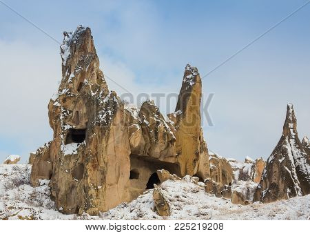 View Of Ancient Uchisar Cave Town And A Castle Of Uchisar Dug From A Mountains In Cappadocia, Centra