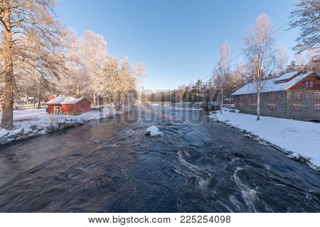 sunrise over water at Knappforsen Lunedet near Karlskoga in Sweden