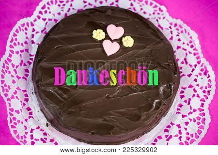 chocalate cake with thank you, pink background