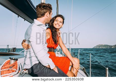 Happy Couple Taking A Romantic Cruise On The Sail Boat