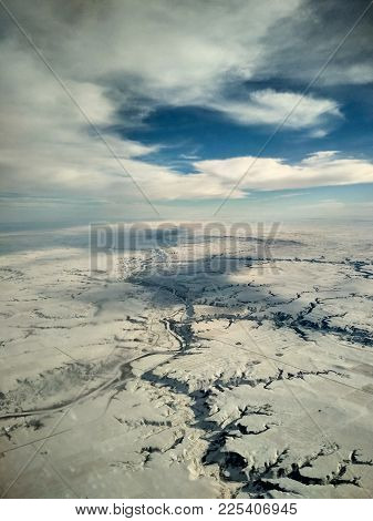 Aerial View Of Canadian Flat Winter Landscape In Winter From An Airplane