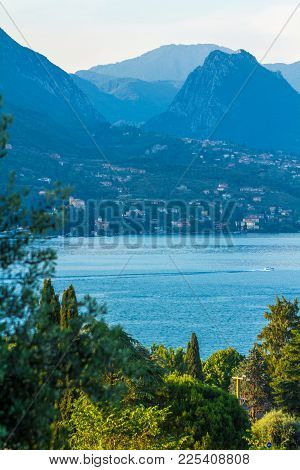Lake Garda, Italy. Peaceful Sunset Looking Out Over The Lake From Maraschina Toward The Mountains