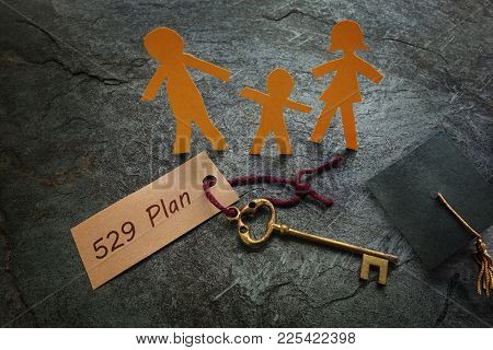 Paper Family Of Three With 529 Plan Gold Key --  College Education Savings Concept