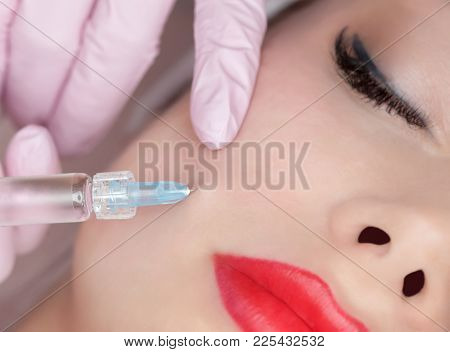 The Doctor Cosmetologist Makes The Rejuvenating Facial Injections Procedure For Tightening And Smoot