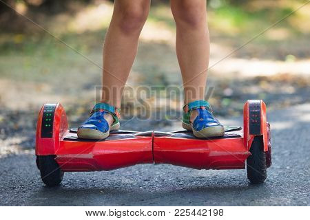 Child On Hover Board. Kids Ride Scooter.