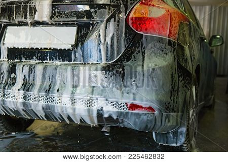 Car Covered With Foam On Car Wash