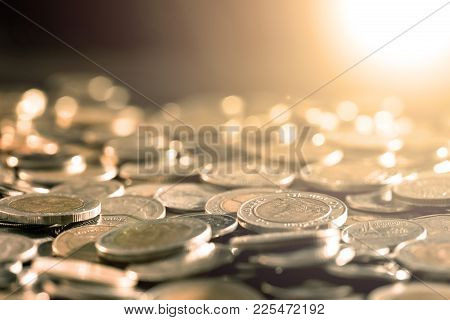 Close Up Money Coin On The Floor In Dark Light , Business And Financial For Money Saving Or Investme