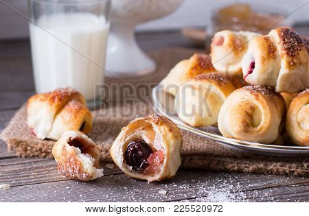 Rugelach With Jam Filling On Plate With Milk On Background