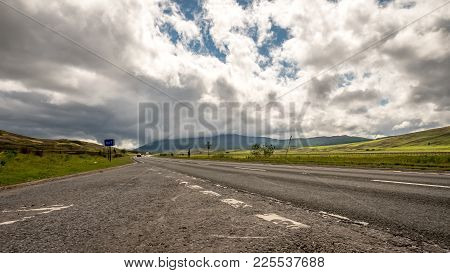 A View Of The A9 Road Running Through The Rolling Hills And Countryside Of The Scottish Cairngorms R