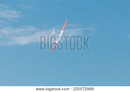 Rc Remotely Controlled Soaring Plane Model Sailplane On Blue Sky In Brisk Wind