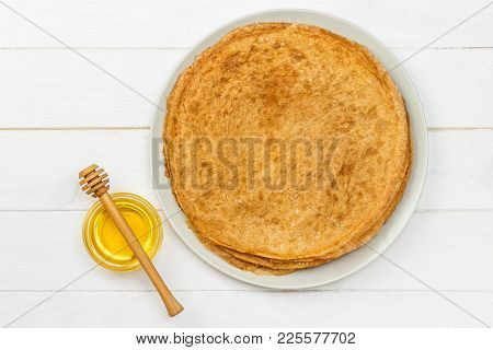 A Pile Of Pancakes, Honey, For The Celebration Of The Carnival. Thin Pancakes For Breakfast. Pancake