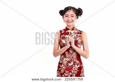 Young Asian Beauty Woman Wearing Cheongsam And Blessing Or Greeting Gesture In Chinese New Year Fest