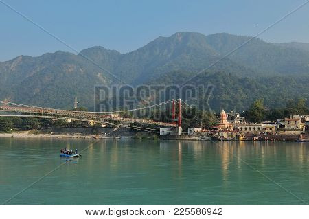 Rishikesh, India - November, 5th, 2017. Beautiful View Of Ganga River Embankment And Ram Jhula Bridg