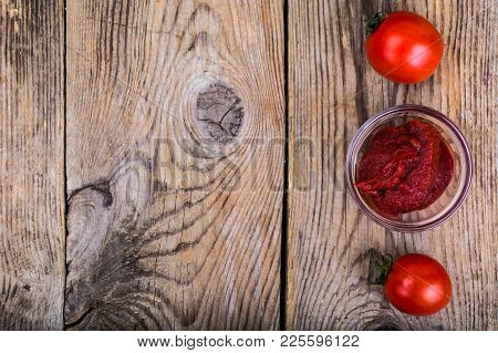 Tomato Paste, Ketchup, Cherry Tomatoes On Wooden Table. Studio Photo