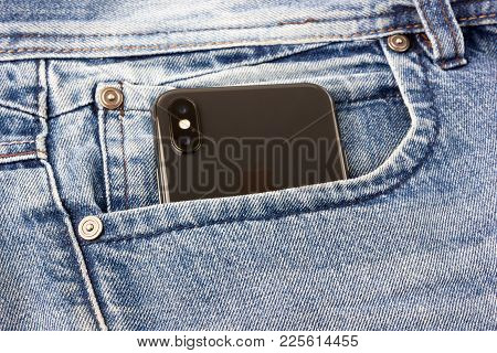 Rostov-on-don, Russia - Feb 2018. Iphone X Sticks Out Of The Pocket Of Blue Jeans. A New Smartphone 
