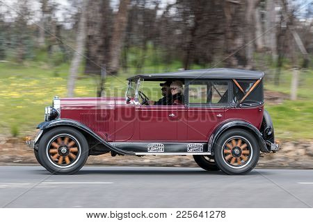 Adelaide, Australia - September 25, 2016: Vintage 1928 Oldsmobile F28 Tourer Driving On Country Road