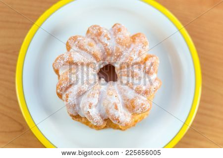 Top View For Donut With Icing Knows In Poland As Gniazdko.