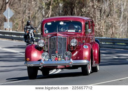 Adelaide, Australia - September 25, 2016: Vintage 1937 Packard 1501 Super 8 Sedan Driving On Country