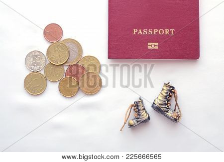 A Passport, Coins And Boots On A White Background. Essential Things For An Hitch-hiking Trip.