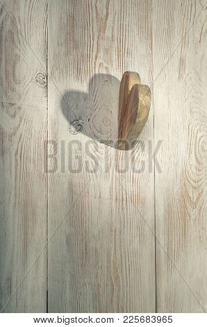 Wooden Heart And Shadow. Valentine's Day Background. Wooden Table.