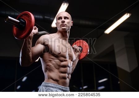 Brutal Strong Bodybuilder Athletic Men Pumping Up Muscles With Dumbbells