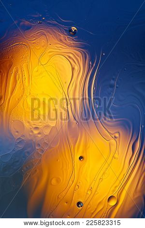 Mixing Water And Oil, Beautiful Color Abstract Background Based On Red And Yellow Circles And Ovals,