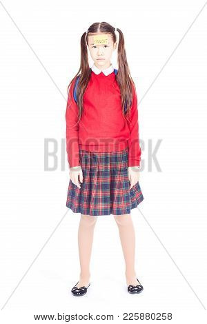 Asian Female Elementary Student In School Uniform Posing On White Background