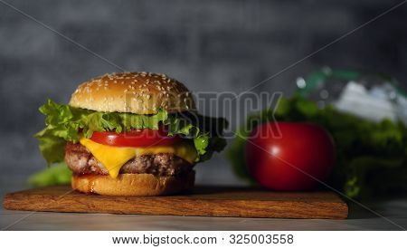 Homemade Hamburger With Fresh Vegetables. Tasty Grilled Burger With With Beef, Cheese, Vegetables. D