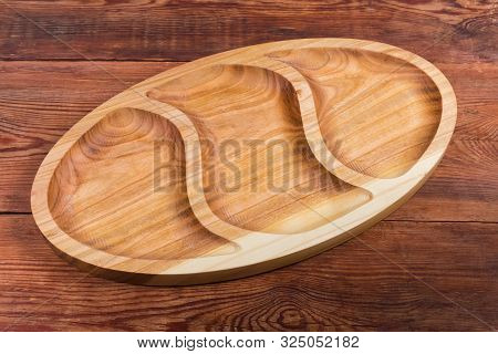 Empty Oval Compartmental Dish With Three Departments Of Original Design Made With Hardwood On The Ol