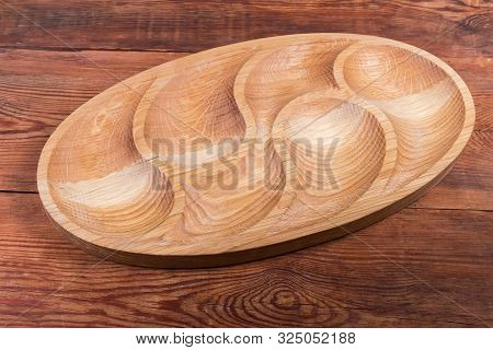 Empty Oval Compartmental Dish With Several Departments Of Original Design Made With Oak On The Old R