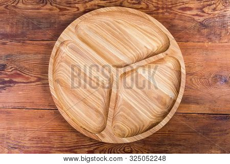 Empty Round Compartmental Dish With Three Departments, Made With Oak Wood On The Old Rustic Table, T