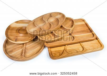 Different Empty Compartmental Dishes And Serving Boards Various Shapes Made With Hardwood On A White