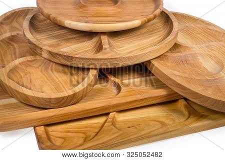Stack Of Different Empty Compartmental Dishes And Serving Boards Various Shapes Made With Hardwood O