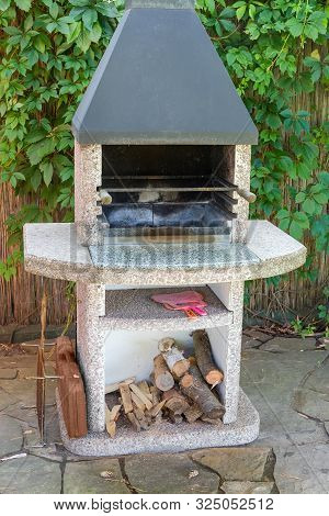 Used Garden Barbecue Fireplace, Made With Weatherproof Concrete, Natural Stone And Stainless Steel O
