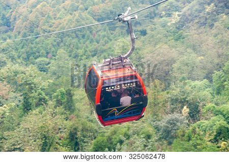 Qingchengshan, Sichuan Province, China - Sept 26, 2019 : Chinese Tourists In Cable Car In Qingcheng 