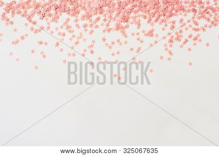 Pastel Pink Confetti Stars On A White Background. Holiday Party Concept