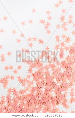 Pastel Pink Confetti Stars On A White Background. Holiday Party Concept