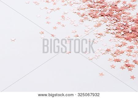 Pastel Pink Confetti Stars On A White Background. Holiday Party Concept