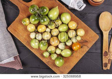 Green Fresh Tomato On A Wooden Kitchen Board, Vegetarian Food, Healthy Nutrition, Fresh Tomatoes