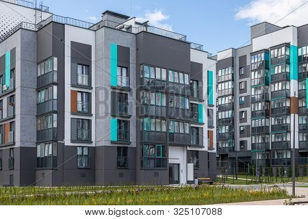Minsk, Belarus - May 2019. Freshly Painted In Grey And Mint Colors Block Of Flats In Dormitory Distr
