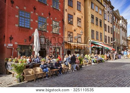 18 September 2018: Stockholm, Sweden - Tourists Enjoying The Sunshine Outside The Cafes And Restaura