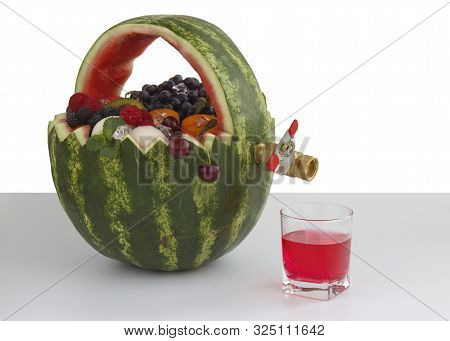 Fruit Basket And Juice Drain Tap. The Basket Is Made Of Watermelon And Filled With Different Fruits