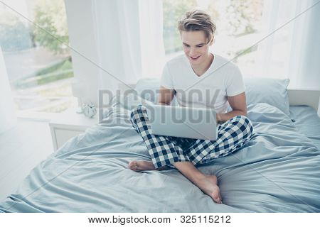 Full Size Of Positive Cheerful Interested Blonde Hair Guy Use His Laptop Read Feednews In Morning Si