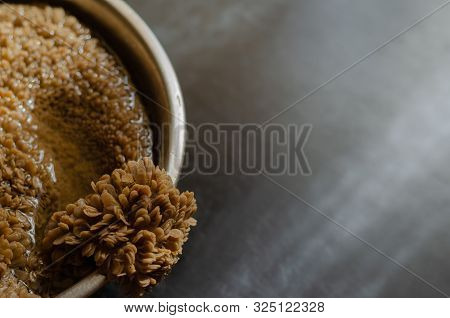 Raw Beef Tripe In A Metal Bowl With Water On The Left. On The Right, Free Space On A Dark Background
