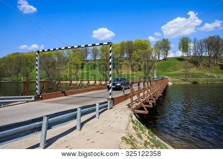 Dubingiai, Lithuania - April 27, 2019: Historical Wooden Bridge Across The Longest Lake Asveja (dubi