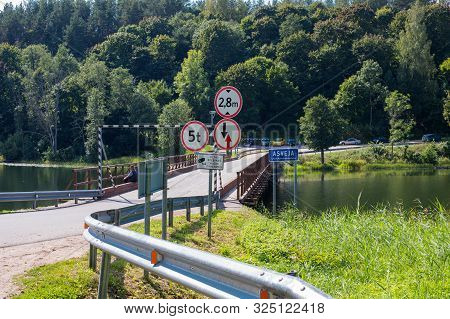 Dubingiai, Lithuania - September 1, 2018: Historical Wooden Bridge Across The Longest Lake Asveja (d