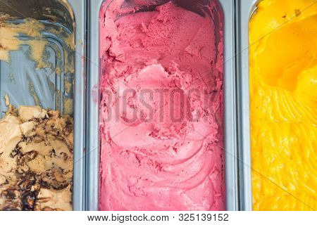 Several Gelato Ice Cream With Mixed Fruit Flavors In A Store Tray